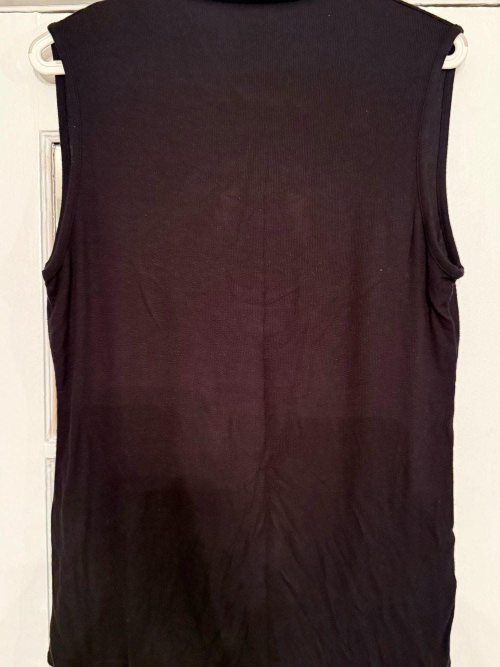 Black sleeveless mock neck shirt